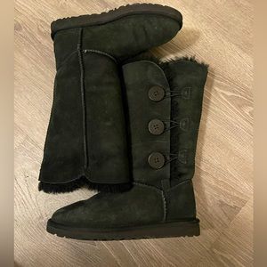 Tall, black Ugg boots with buttons